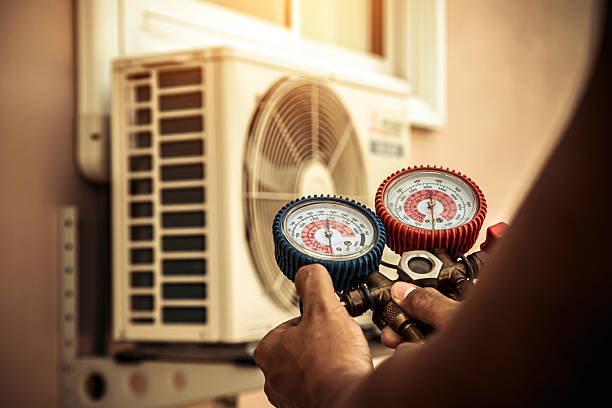 Professional Air Conditioning Service technician working in Saint Joe, IN